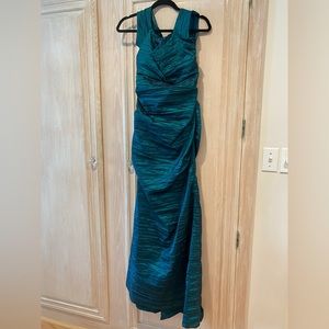 Full length, off shoulder, taffeta teal formal dress.